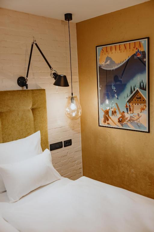 Postel nebo postele na pokoji v ubytování ONE66 Hotel