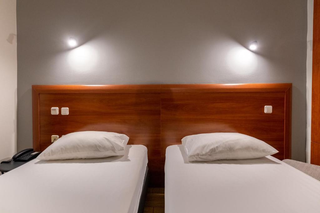 Letto o letti in una camera di Stalis Hotel