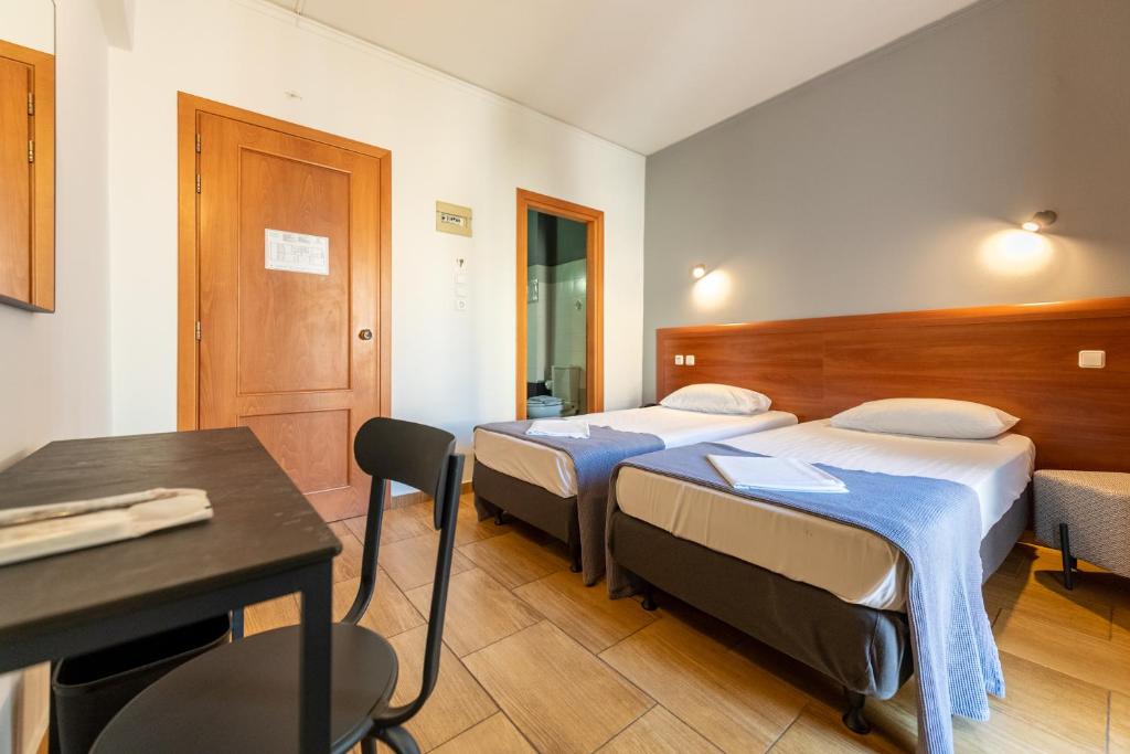 Letto o letti in una camera di Stalis Hotel