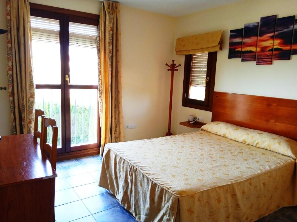 Postel nebo postele na pokoji v ubytování Hotel El Zorro