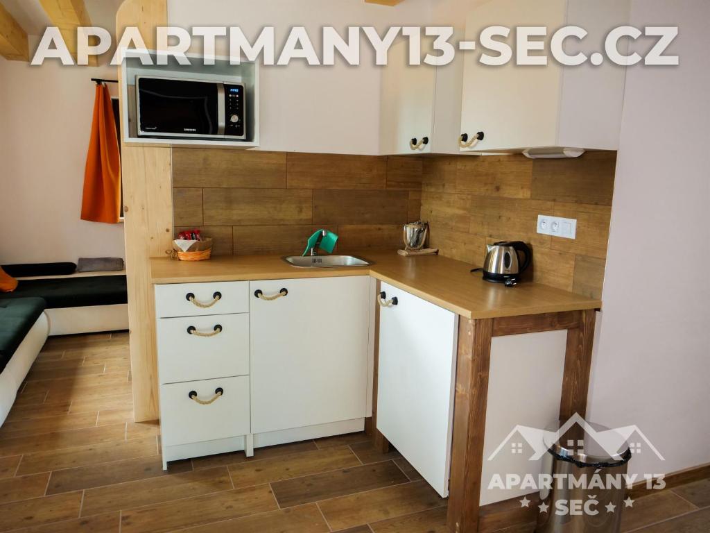 Kuchyň nebo kuchyňský kout v ubytování Apartmánový dům 13 Rodinný