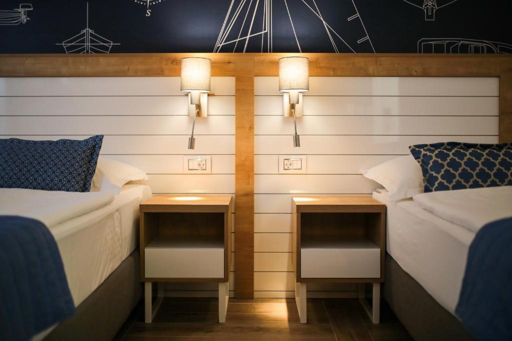Postel nebo postele na pokoji v ubytování HOTEL IVANDO - K&S