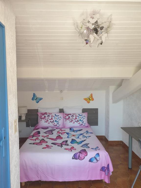 Postel nebo postele na pokoji v ubytování Horus Hôtel