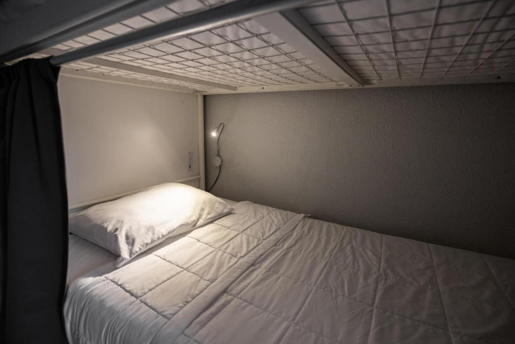 Postel nebo postele na pokoji v ubytování Bungalows Hostel