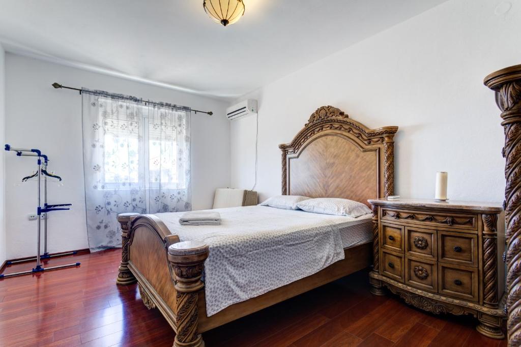 Postel nebo postele na pokoji v ubytování Vera Apartments