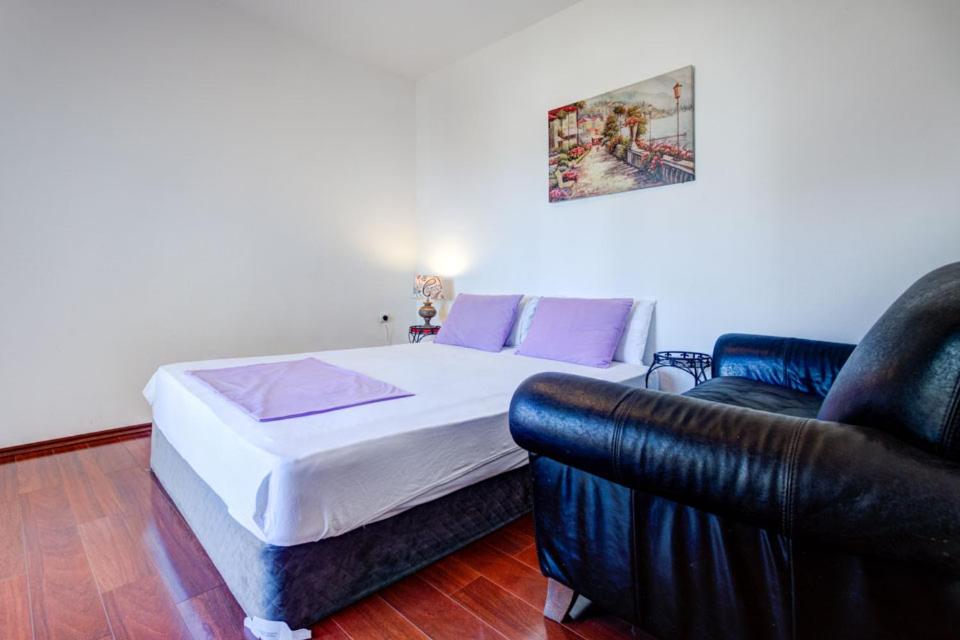 Postel nebo postele na pokoji v ubytování Vera Apartments