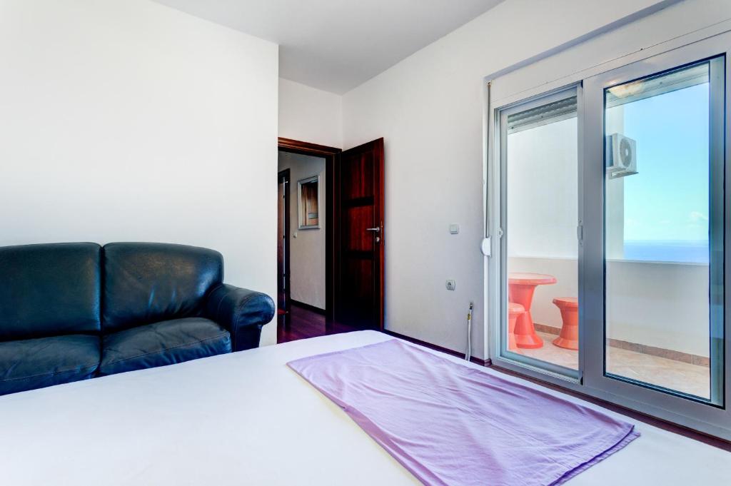 Postel nebo postele na pokoji v ubytování Vera Apartments