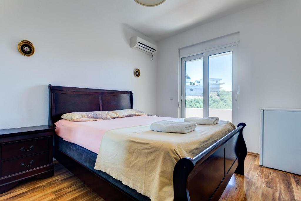Postel nebo postele na pokoji v ubytování Vera Apartments