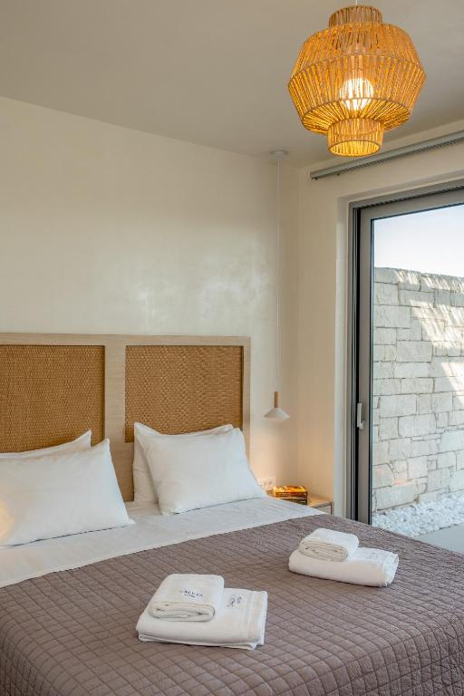 Postel nebo postele na pokoji v ubytování Salvia Luxury Collection Suites