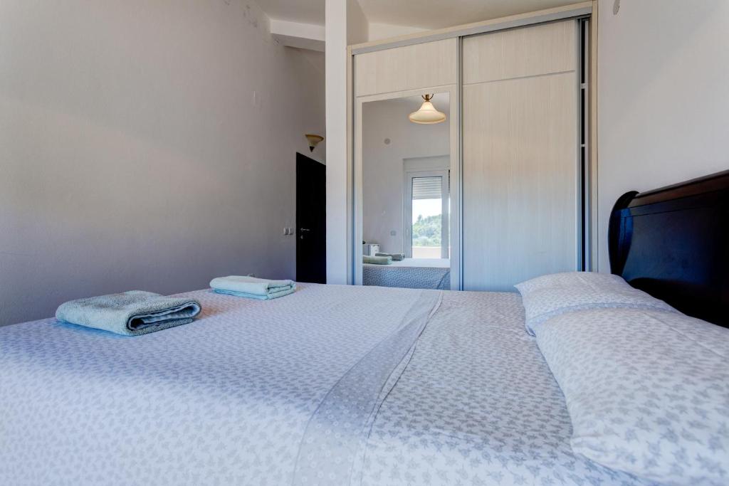 Postel nebo postele na pokoji v ubytování Vera Apartments