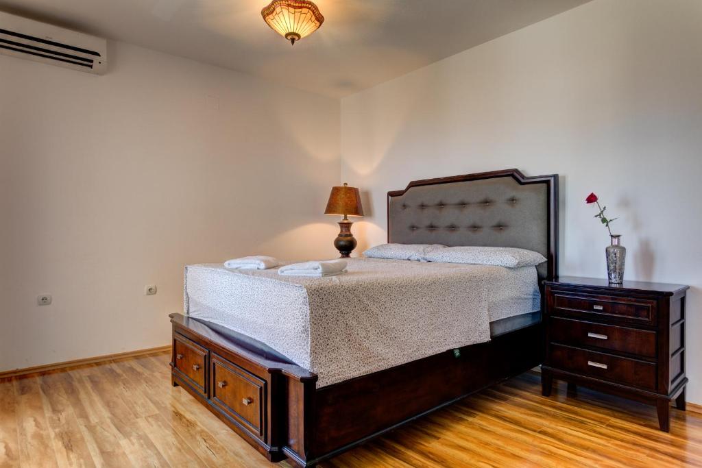 Postel nebo postele na pokoji v ubytování Vera Apartments