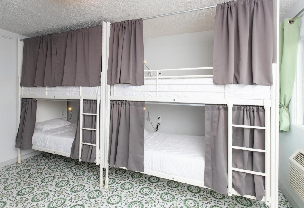 Postel nebo postele na pokoji v ubytování Bungalows Hostel