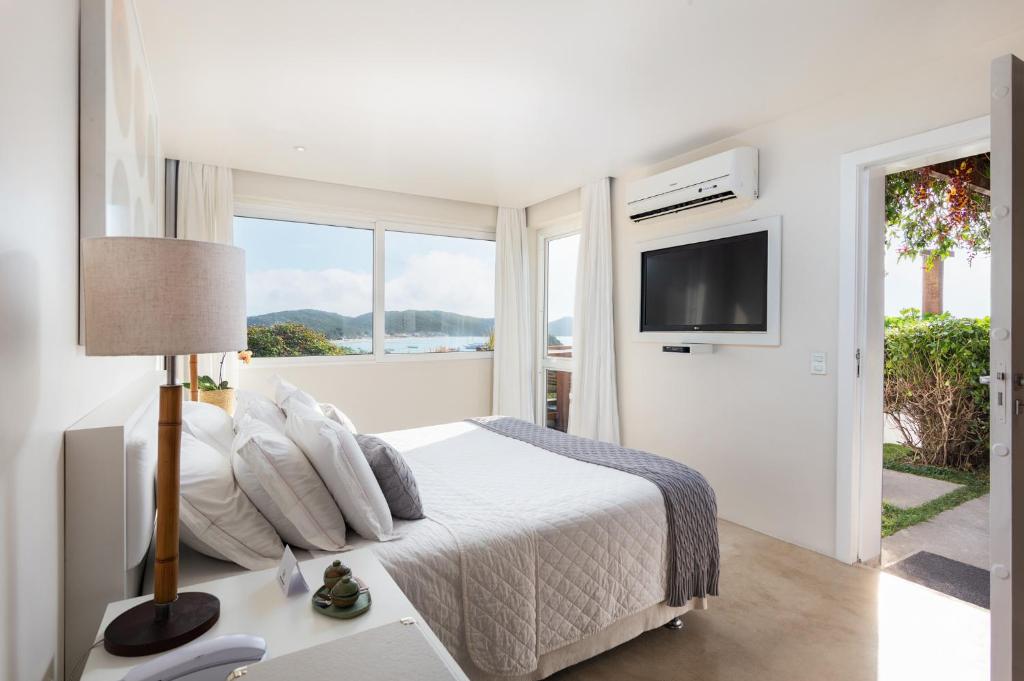 Postel nebo postele na pokoji v ubytování Abracadabra Boutique Hotel