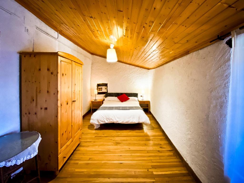Postel nebo postele na pokoji v ubytování El Buxaus de la Muntanya