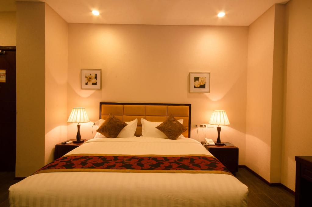 Postel nebo postele na pokoji v ubytování Palawan Uno Hotel