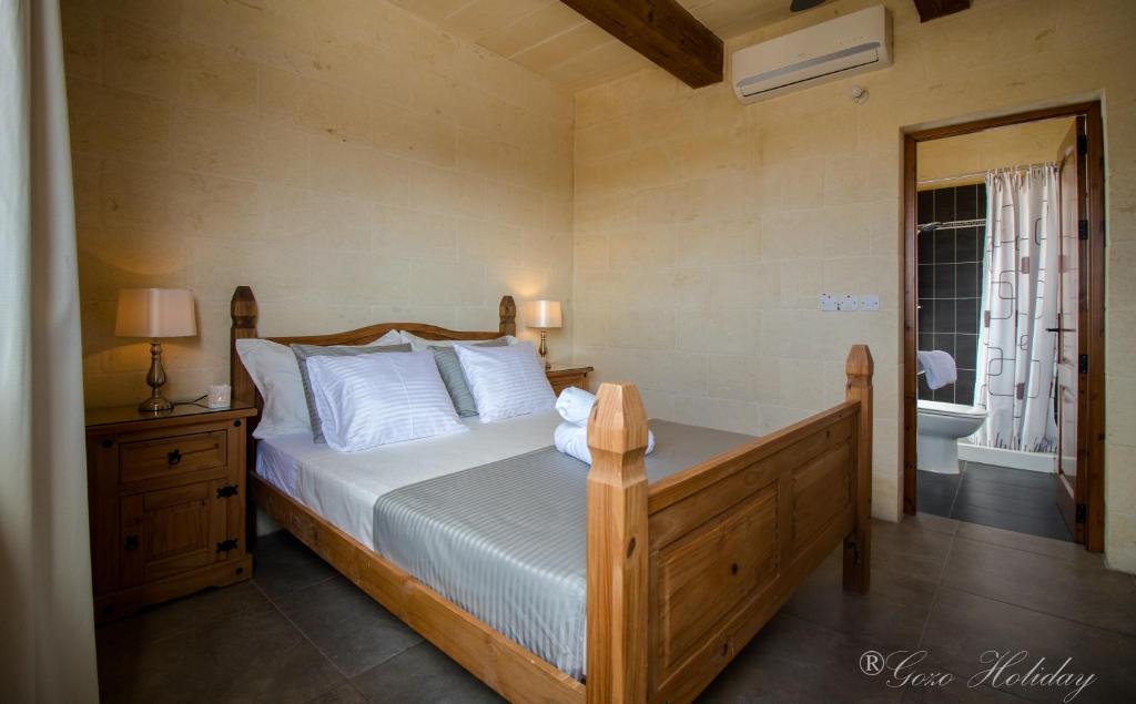 Postel nebo postele na pokoji v ubytování Villa Mandolina