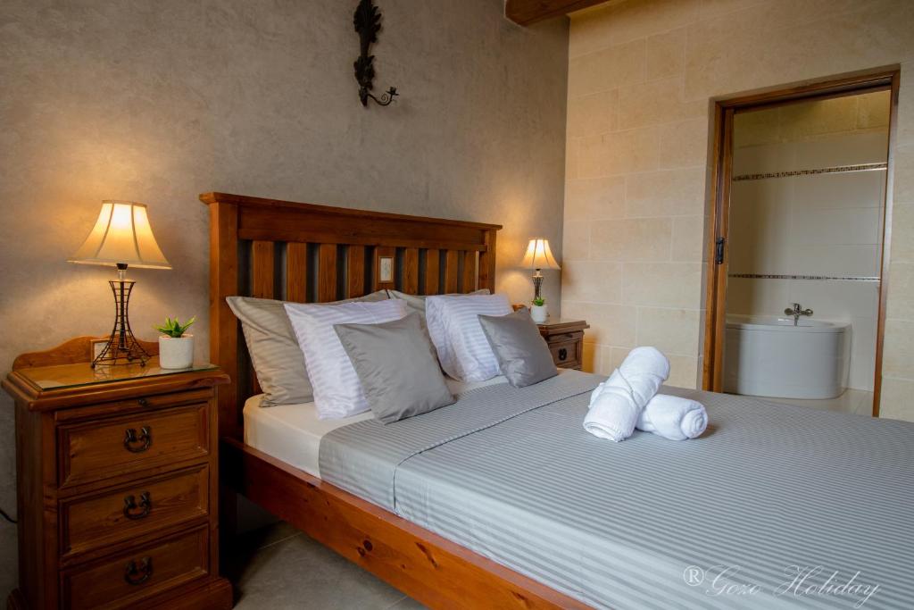 Postel nebo postele na pokoji v ubytování Villa Mandolina