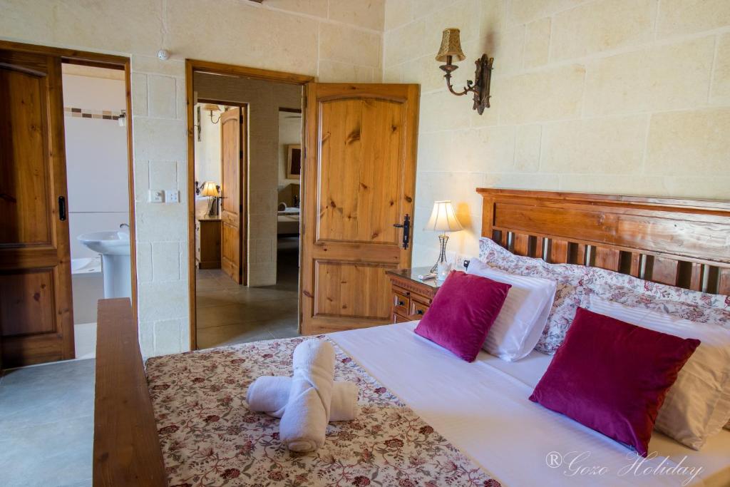 Postel nebo postele na pokoji v ubytování Villa Mandolina