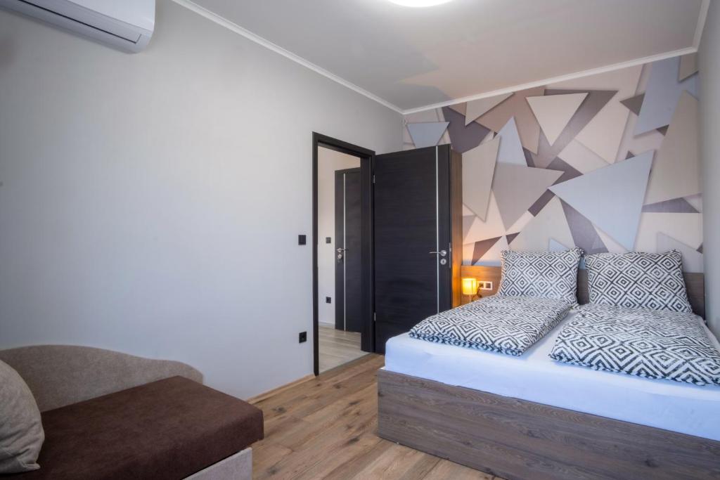 Łóżko lub łóżka w pokoju w obiekcie MyFlat Premium Resort