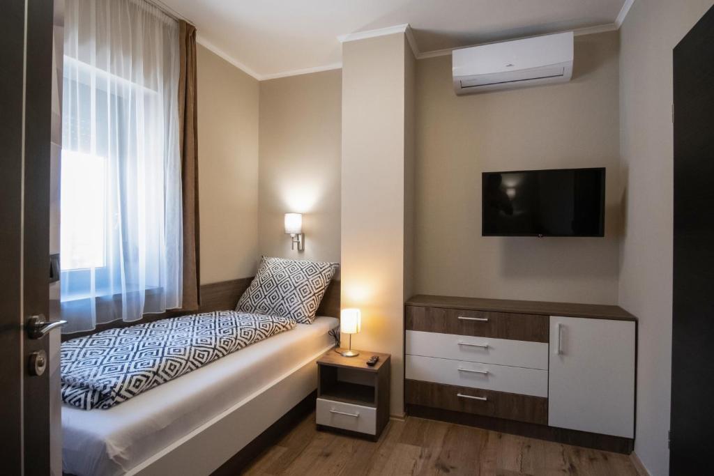 Łóżko lub łóżka w pokoju w obiekcie MyFlat Premium Resort