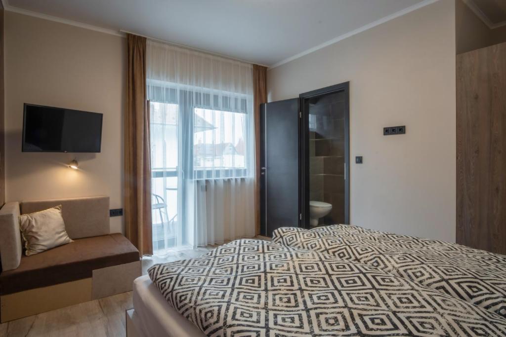 Łóżko lub łóżka w pokoju w obiekcie MyFlat Premium Resort