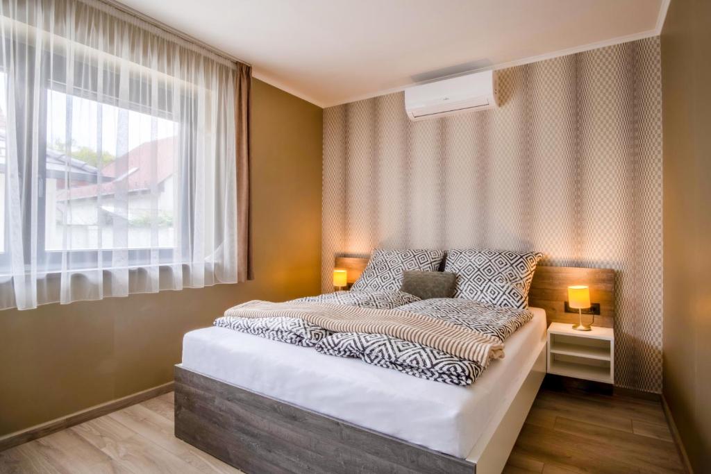Łóżko lub łóżka w pokoju w obiekcie MyFlat Premium Resort