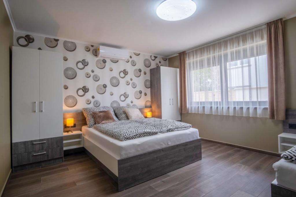 Łóżko lub łóżka w pokoju w obiekcie MyFlat Premium Resort