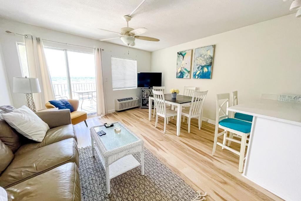 a living room with a couch and a table at Perdido Skye in Perdido Key