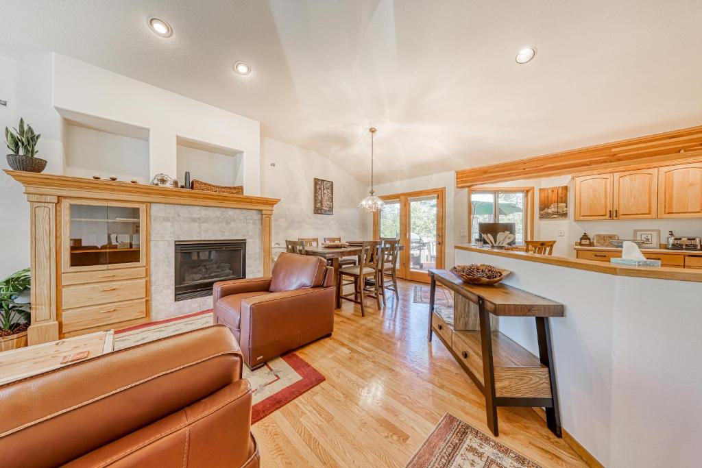 a kitchen and living room with a couch and a table at Sunset Mountain Retreat in Sunriver