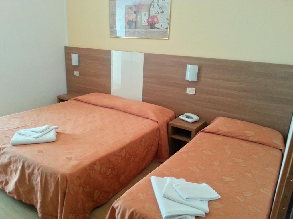 Postel nebo postele na pokoji v ubytování Hotel Sara