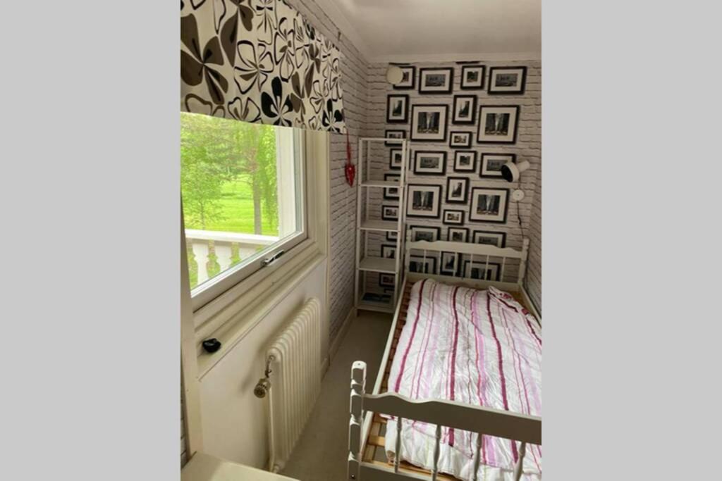 a small room with a bed and a window at Surrounded by nature in Bjurholm in Bjurholm