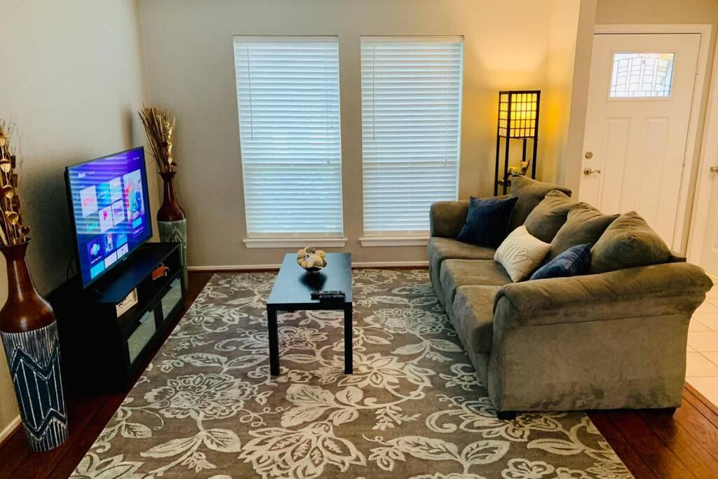 a living room with a couch and a table at New TEXAS House 3 Bed in Woodlands in The Woodlands