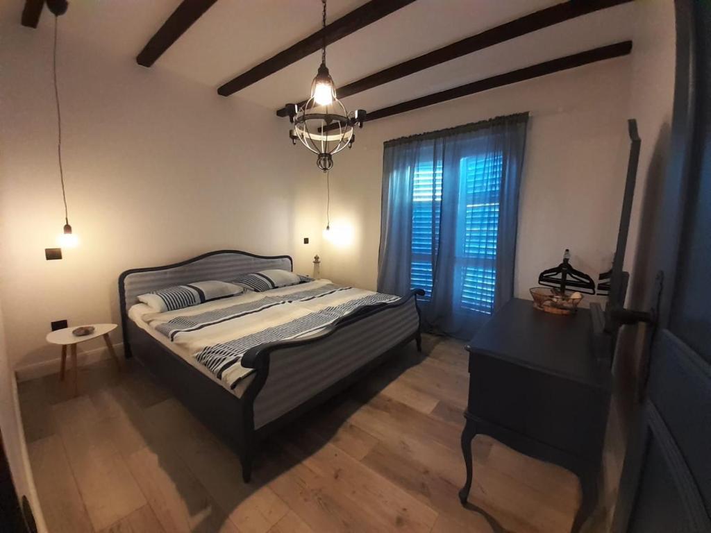 Postel nebo postele na pokoji v ubytování Apartments Dile