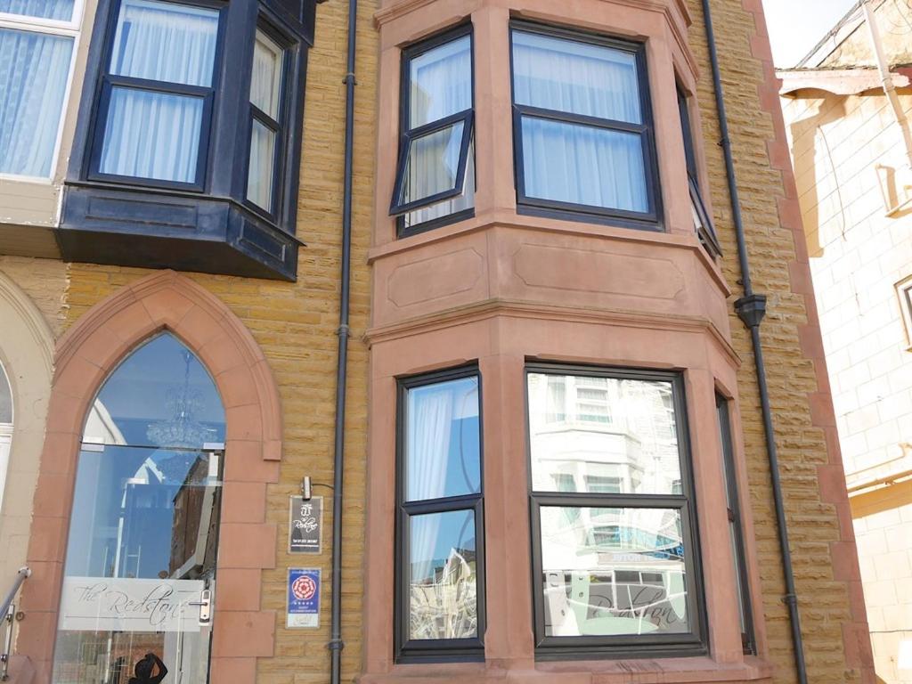 a building with four windows on the side of it at The Redstone Guesthouse in Blackpool