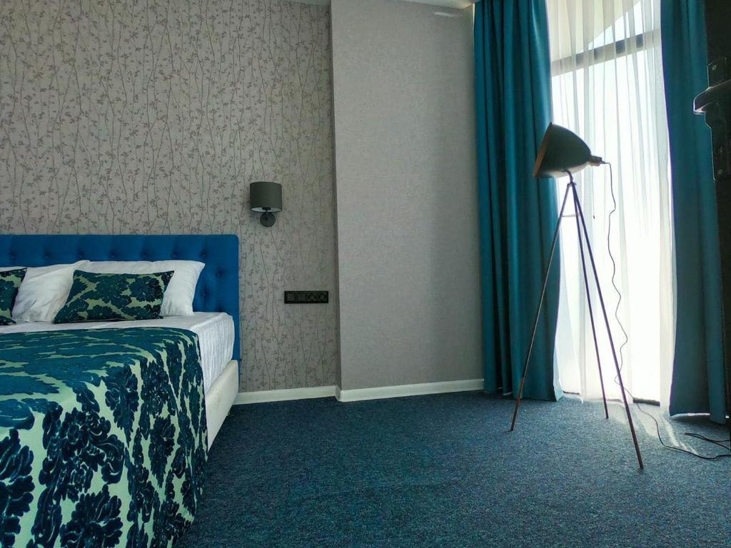 Postel nebo postele na pokoji v ubytování Pano Hotel