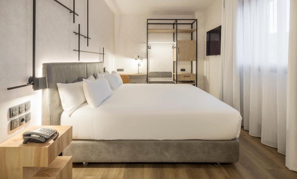 Postel nebo postele na pokoji v ubytování Hotel Ilunion San Mamés