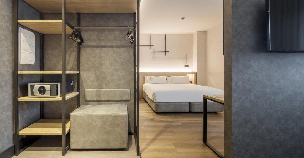 Postel nebo postele na pokoji v ubytování Hotel Ilunion San Mamés