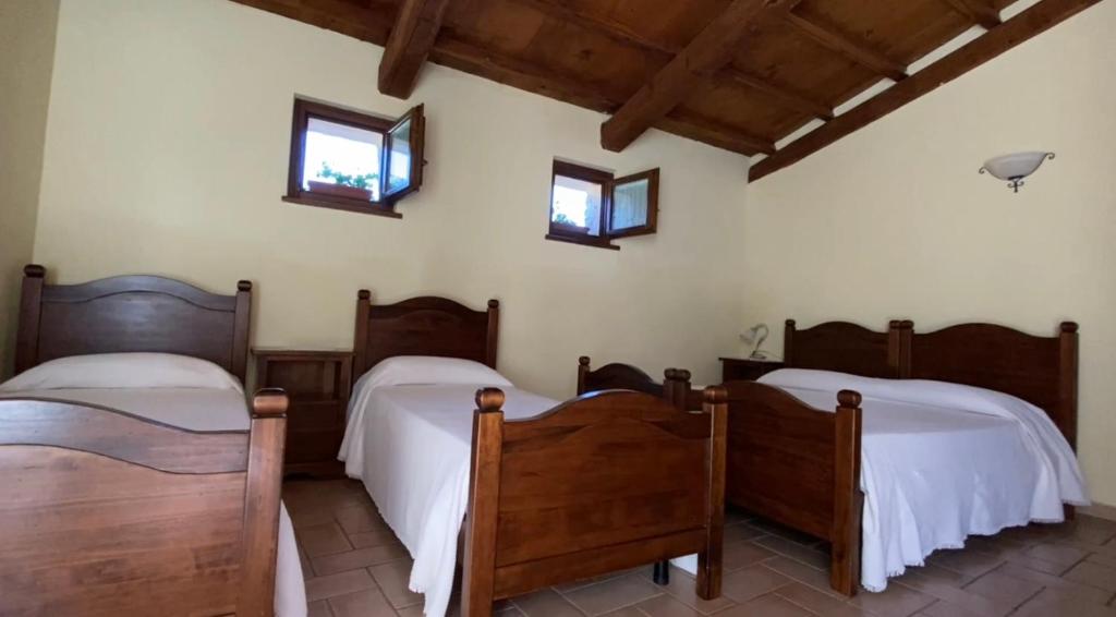 Postel nebo postele na pokoji v ubytování Locanda Cacio Re