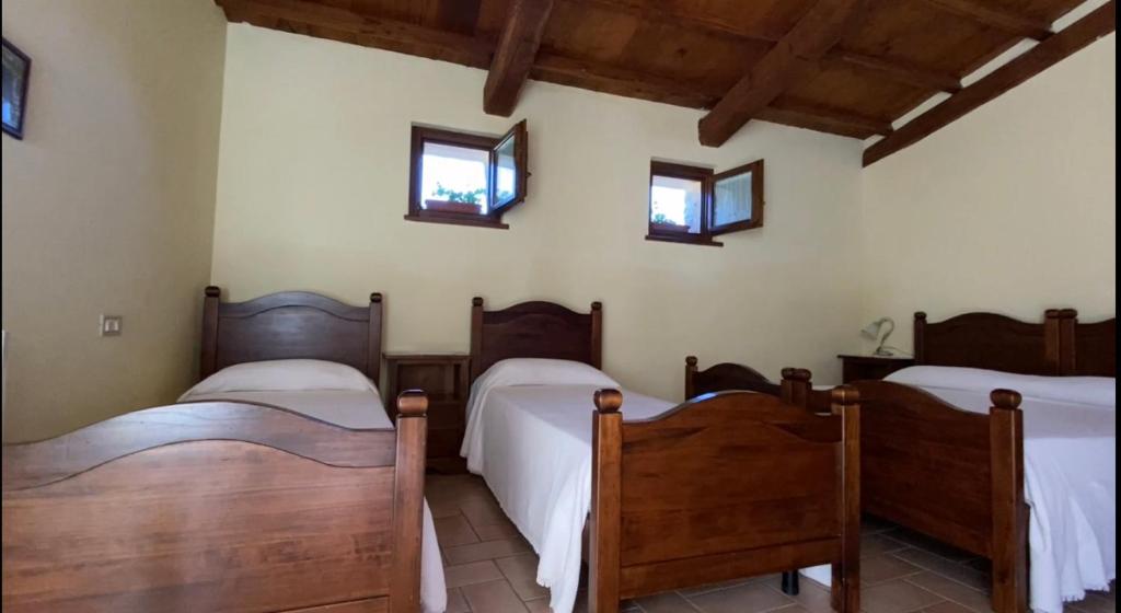Postel nebo postele na pokoji v ubytování Locanda Cacio Re
