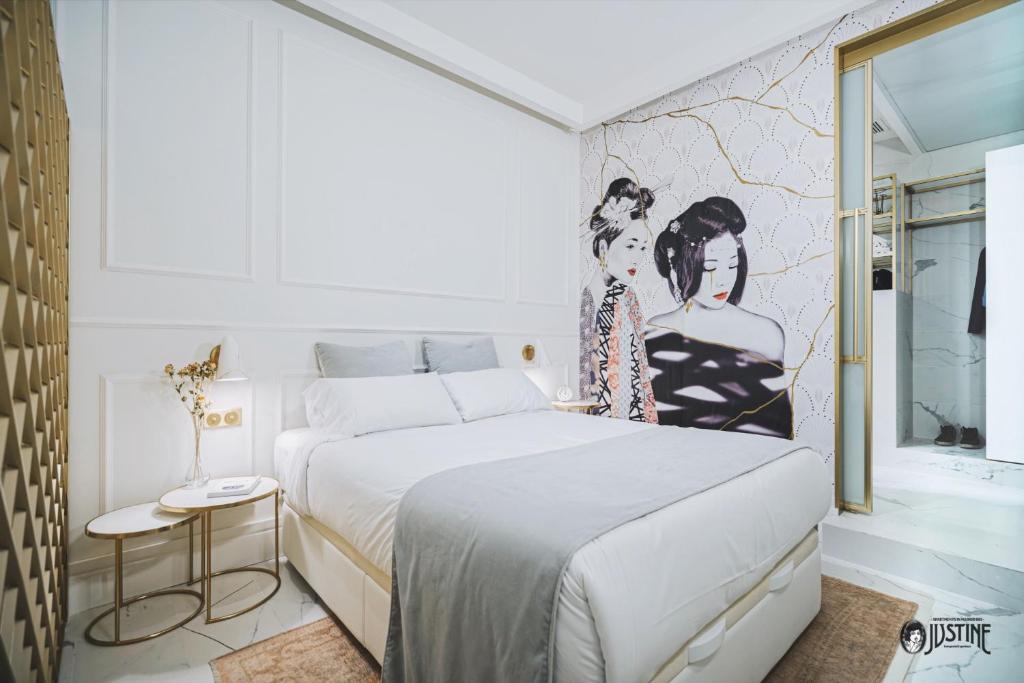 Suite Kintsugi by Justine Apartments Apartamento turístico en Madrid Río tesisinde bir odada yatak veya yataklar