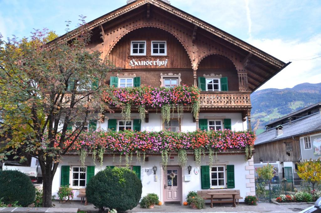 a building with flowers on the side of it at Hanserhof in Fügen