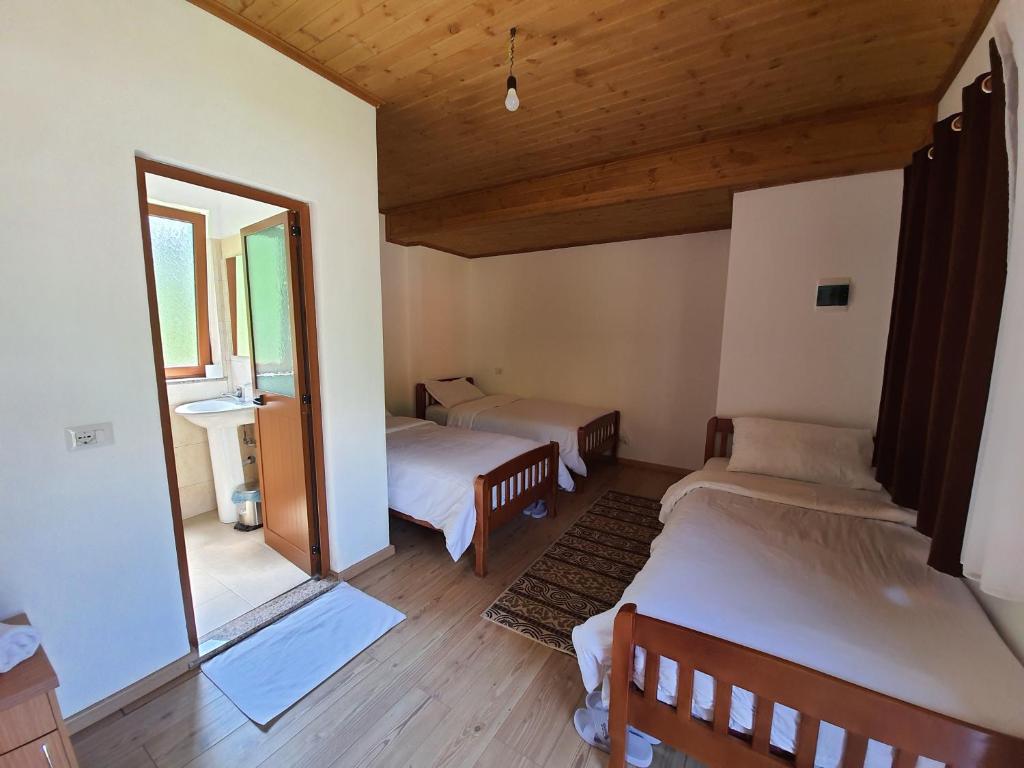 Letto o letti in una camera di Guest House Flodisa