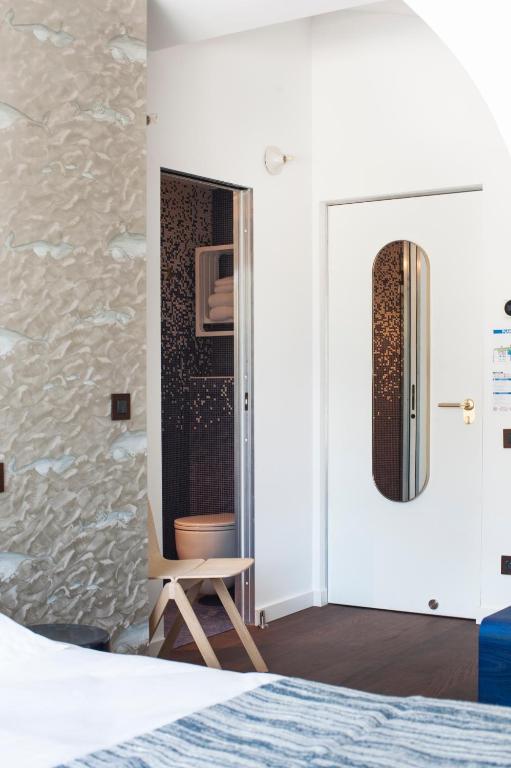 Postel nebo postele na pokoji v ubytování Boutique Hotel Miramar