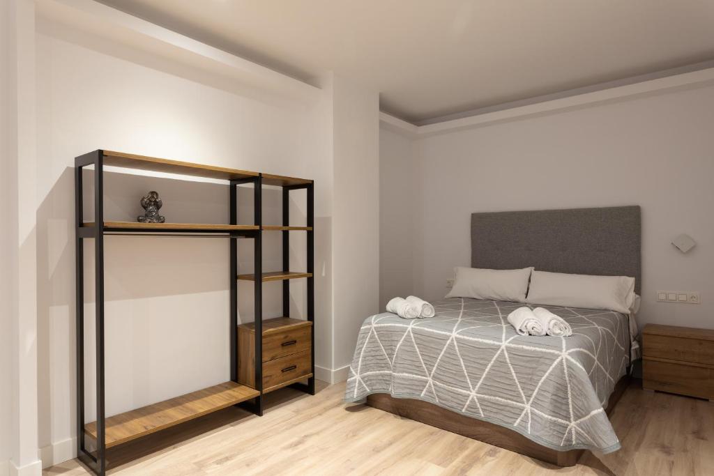 A bed or beds in a room at APARTAMENTOS ARRIET