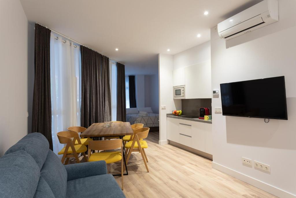 A television and/or entertainment centre at APARTAMENTOS ARRIET