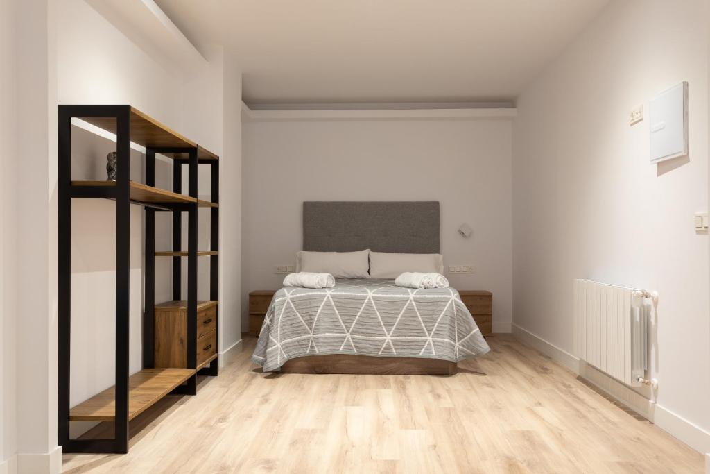 A bed or beds in a room at APARTAMENTOS ARRIET