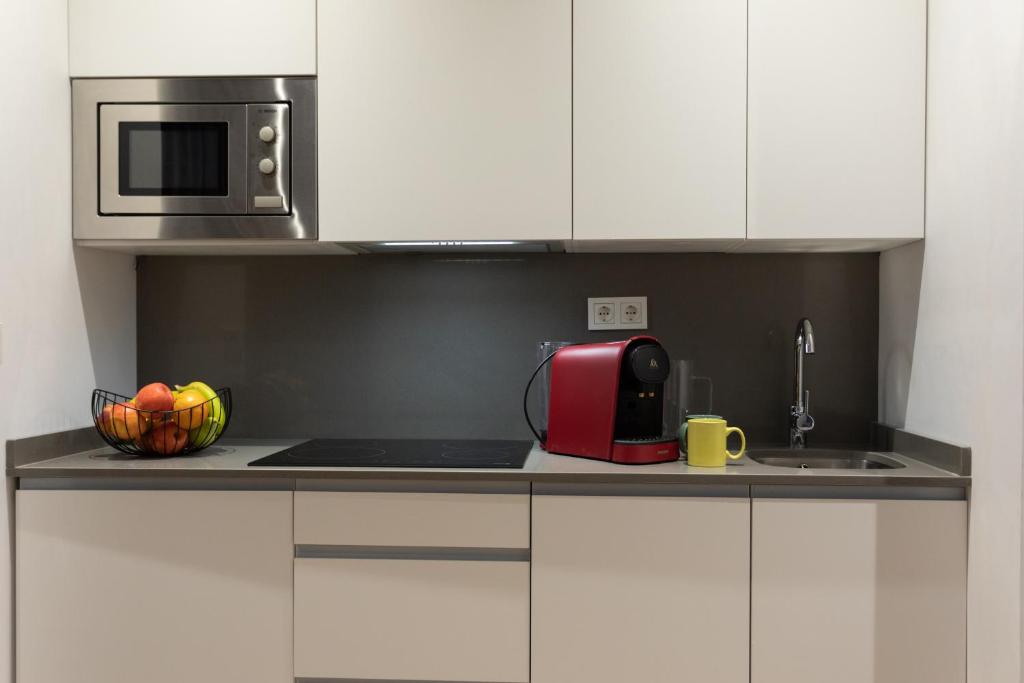 A kitchen or kitchenette at APARTAMENTOS ARRIET