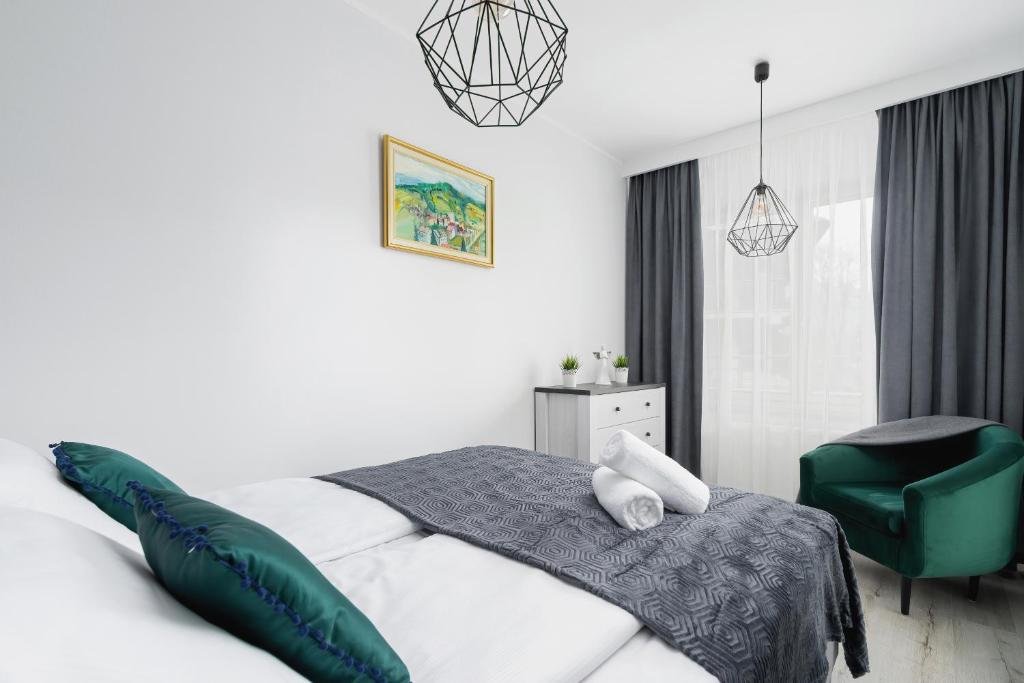 Posteľ alebo postele v izbe v ubytovaní Stara Polana Apartamenty & Spa Zakopane by Renters Prestige