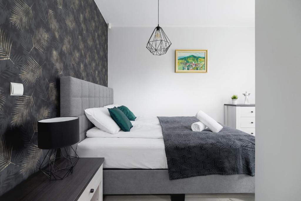 Posteľ alebo postele v izbe v ubytovaní Stara Polana Apartamenty & Spa Zakopane by Renters Prestige