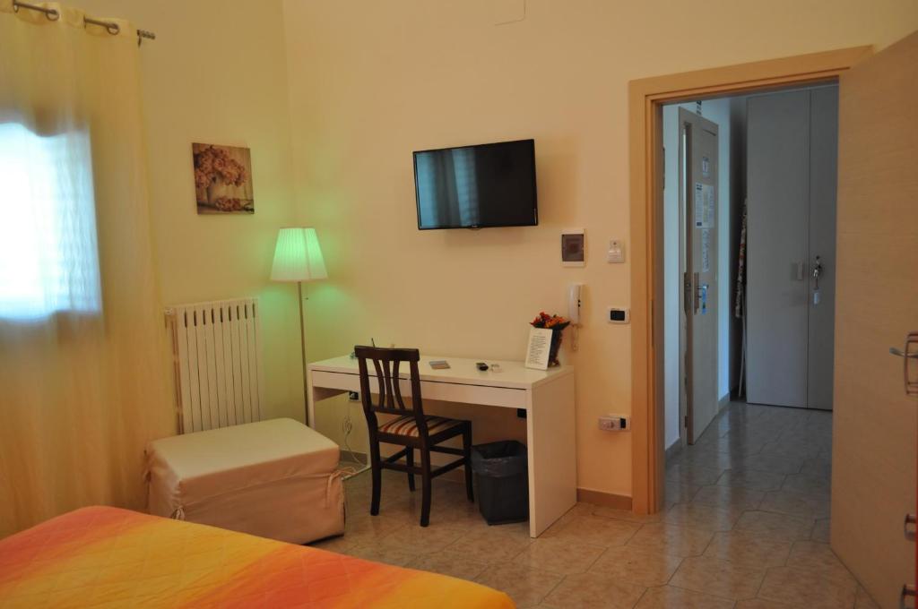 A bed or beds in a room at 7 Contrade